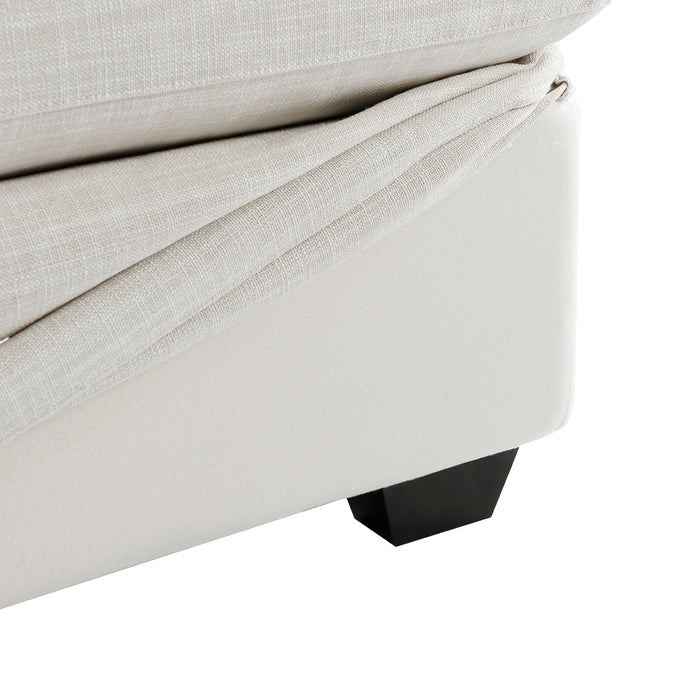 Close-up of [Brand] beige fabric sofa corner with leg.