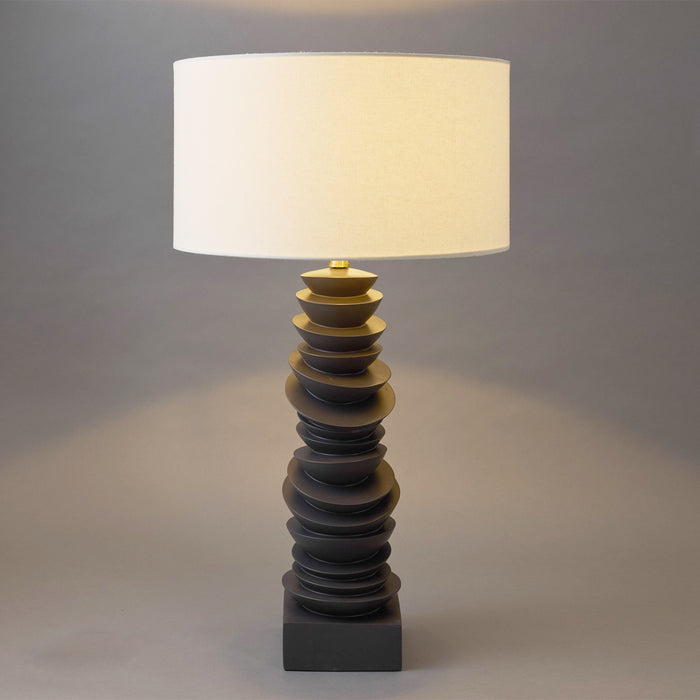 [Brand] modern lamp with stacked base, white cylindrical shade.