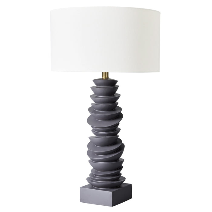 [Brand] lamp with white shade, sculpted gray stacked base.
