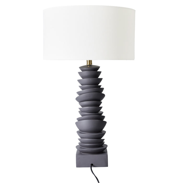 [Brand] table lamp with layered gray base, white shade.