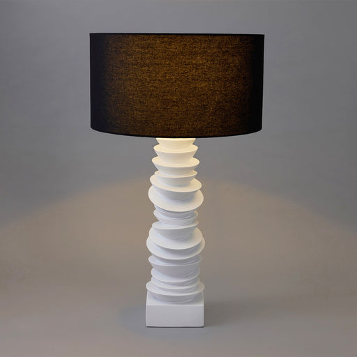 Elegant [Brand] lamp with black shade and sculpted base.