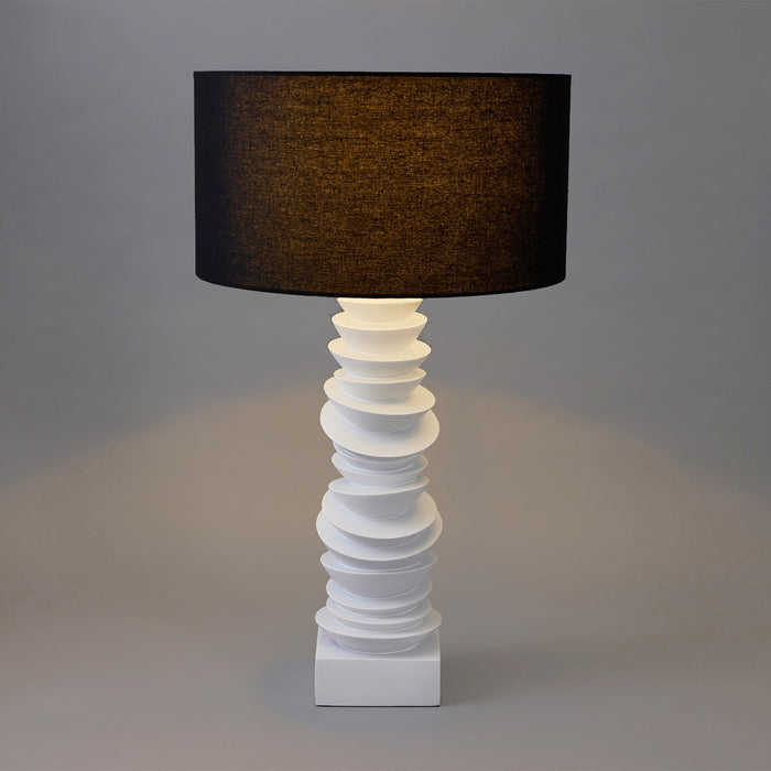 Elegant [Brand] lamp with black shade and sculpted base.