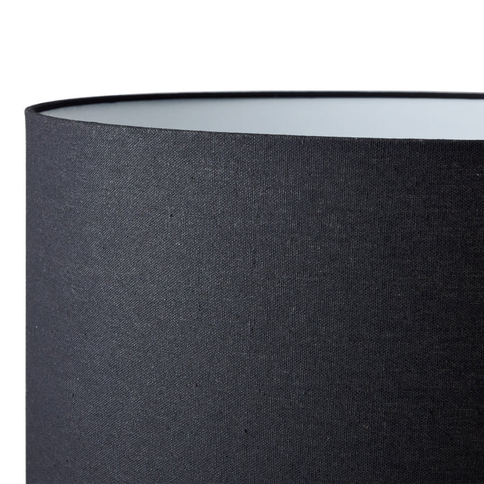 [Brand] black fabric lampshade with minimalist, modern design.
