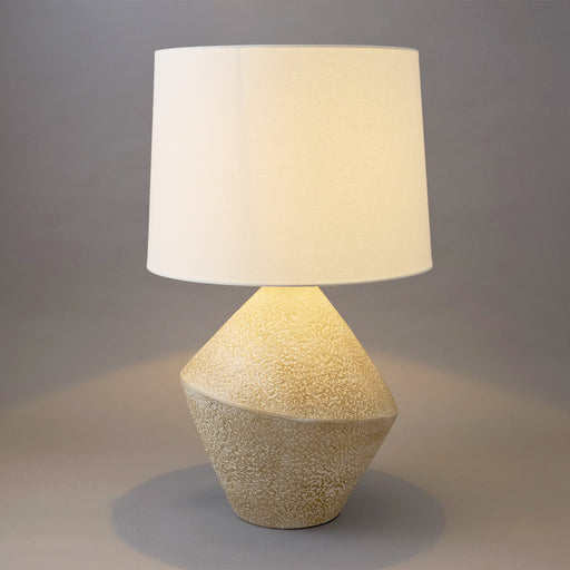 [Brand] textured lamp with beige base and white shade.