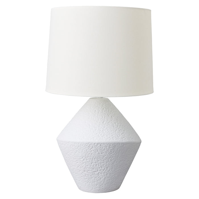 A white lamp with textured base and cylindrical shade. [Brand]