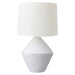 A white lamp with textured base and cylindrical shade. [Brand]