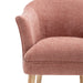 [Brand] pink fabric chair with natural wooden legs, close-up.