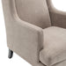 [Brand] beige upholstered armchair with curved arms and cushion.