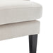 Beige upholstered chair with dark legs from [Brand].