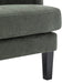 Close-up of [Brand] green upholstered chair with black legs.