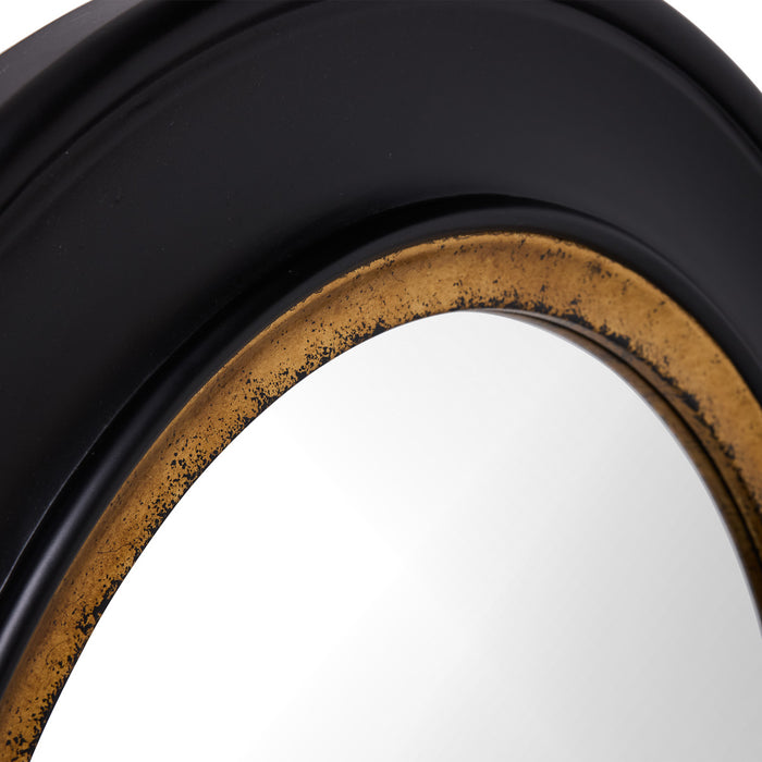 Close-up of [Brand] black and gold mirror frame design.