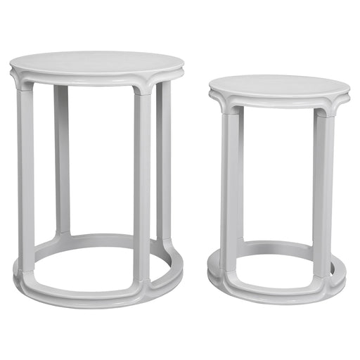Two white nesting tables with circular tops from [Brand].