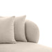 Two beige [Brand] cushions on a comfortable fabric sofa.