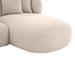 Beige sectional sofa with rounded edges and pillows, [Brand].
