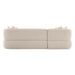 [Brand] beige sofa viewed from the back, with pillows.