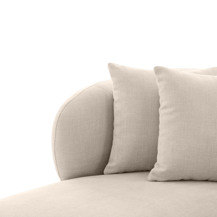 [Brand] beige sofa with soft cushions and rounded armrest.