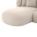 [Brand] beige sectional sofa with rounded edges and cushions.
