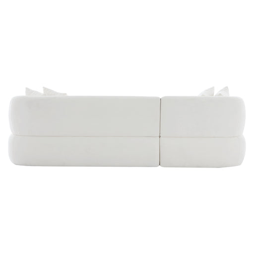 [Brand] modern white sofa with cushions, viewed from rear.