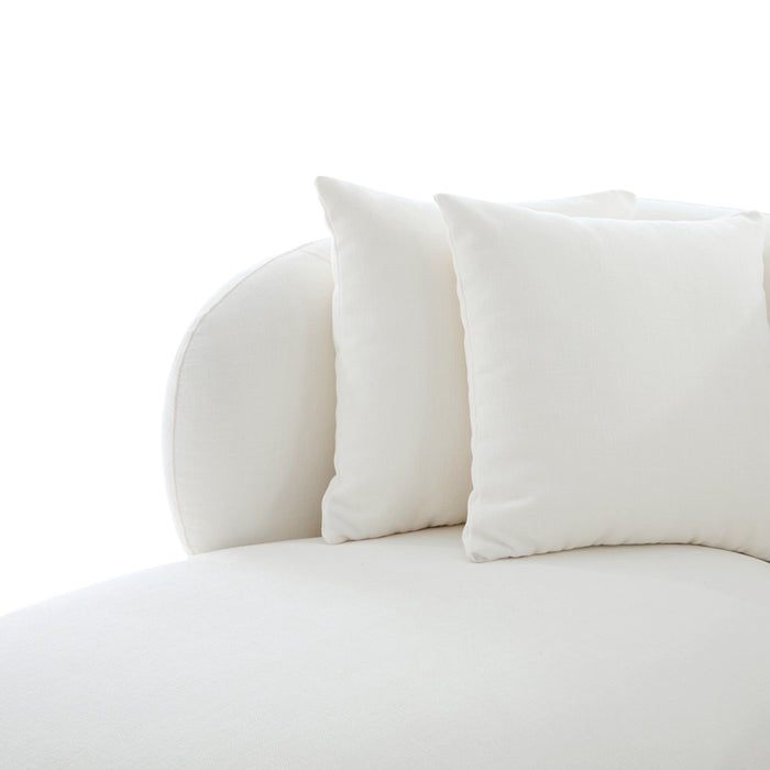 [Brand] white sofa with plush cushions, elegant minimalist design.