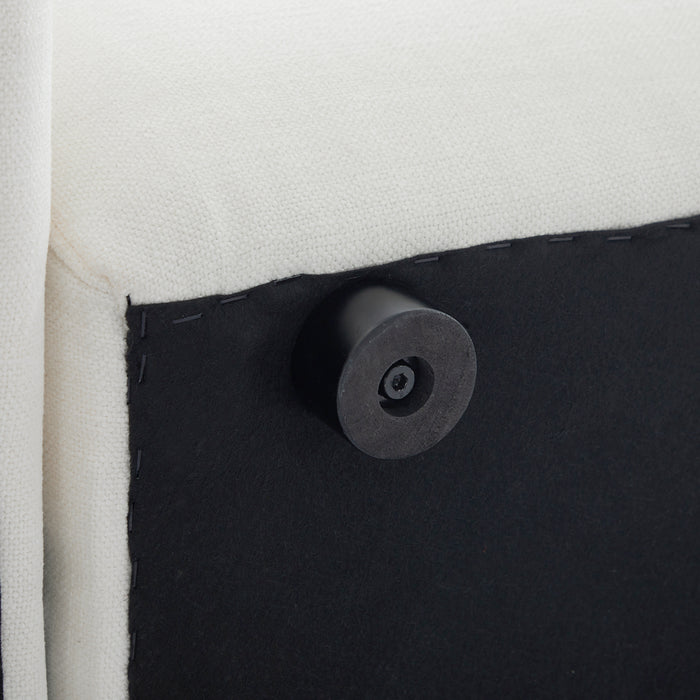 Black furniture leg attached beneath [Brand] white upholstered couch.