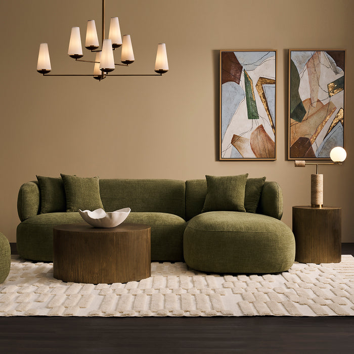 Stylish green sectional sofa by [Brand] with modern decor.
