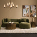 Stylish green sectional sofa by [Brand] with modern decor.