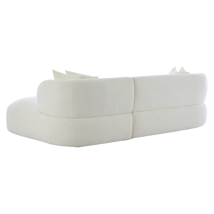 White curved sofa with pillows, rear view, [Brand] design.