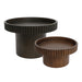 Two [Brand] round wooden tables with ribbed edges displayed.
