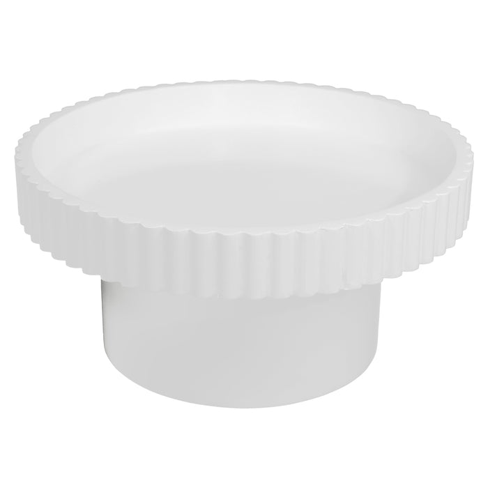 White, round table with ribbed edges from [Brand].