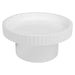 White, round table with ribbed edges from [Brand].