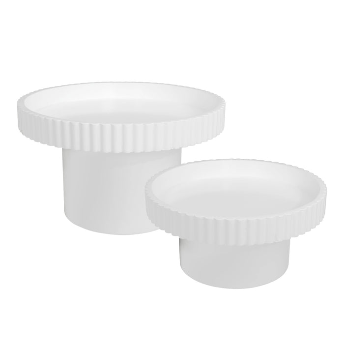 Two white round tables with ridged edges, [Brand].