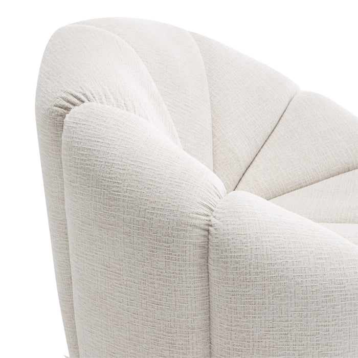Cream upholstered armchair featuring textured fabric by [Brand].
