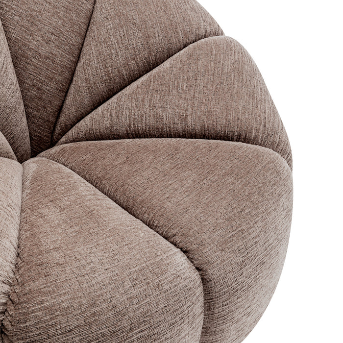 [Brand] beige cushioned furniture close-up with textured fabric detail.