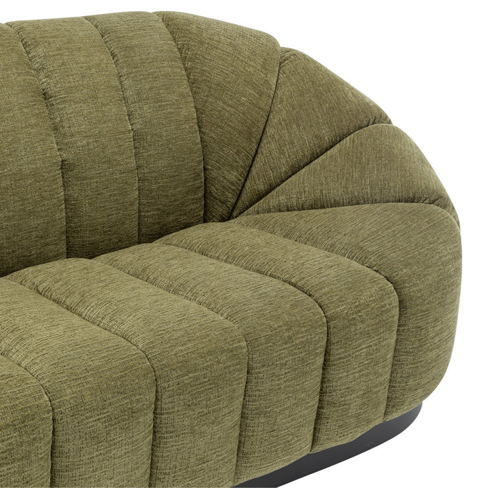 Olive green plush sofa by [Brand], featuring vertical stitching.