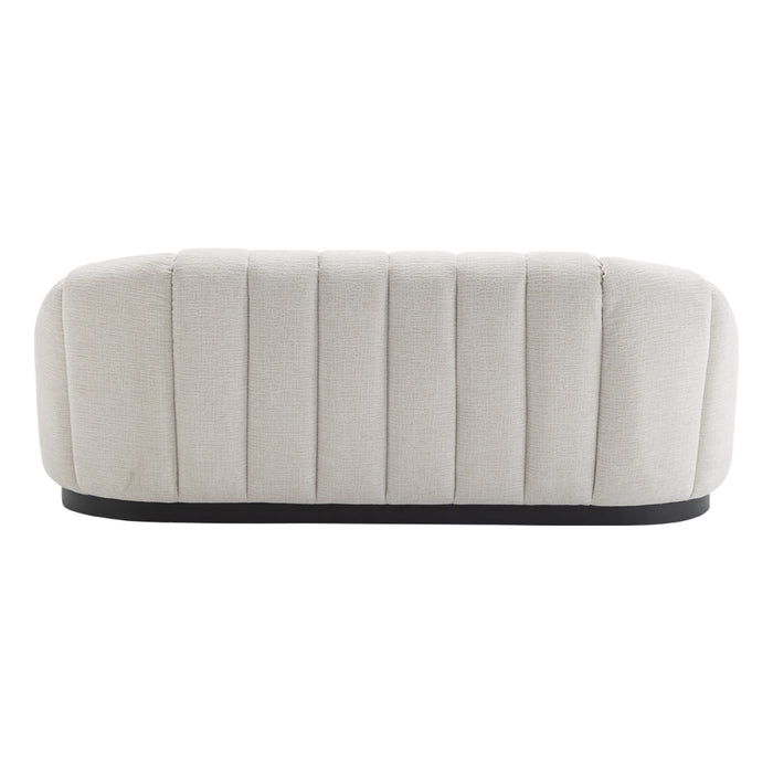 [Brand] cream tufted ottoman with textured fabric and base.