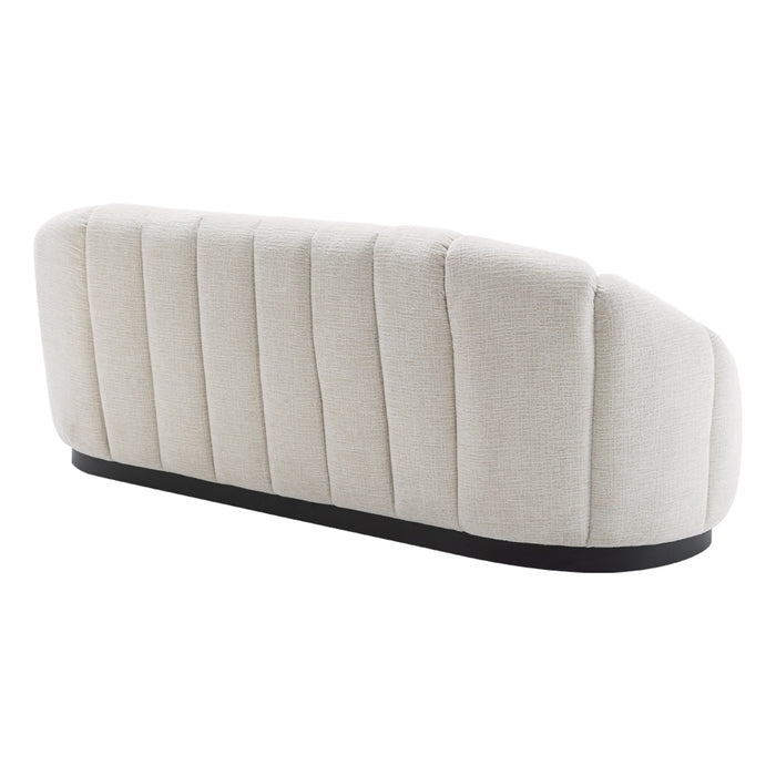 Beige [Brand] sofa with vertical tufting and black base.