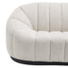 [Brand] white tufted sofa with curved, textured upholstery design.