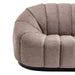 Plush beige sofa by [Brand] with vertical tufted design.