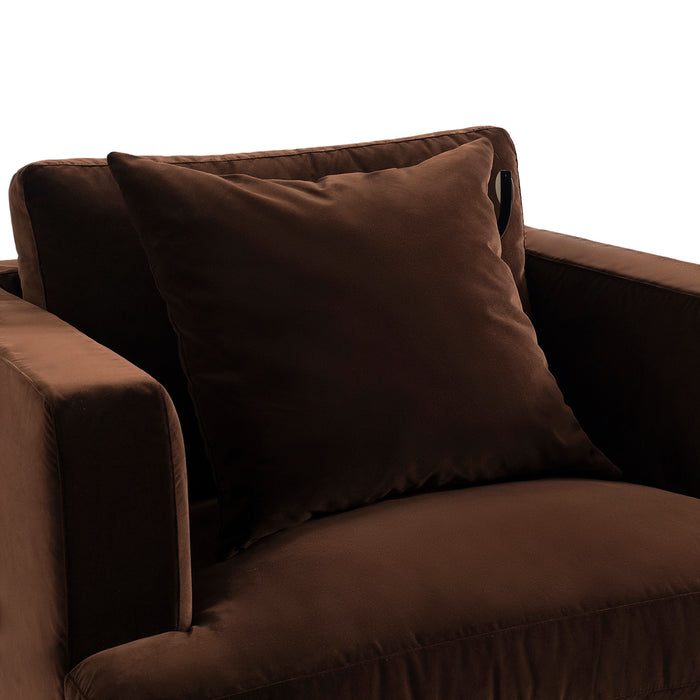 [Brand] brown velvet armchair with plush square cushion.