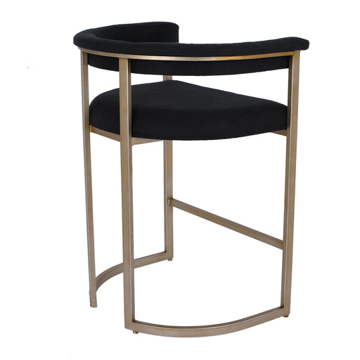 A modern [Brand] chair with black seat, gold frame.