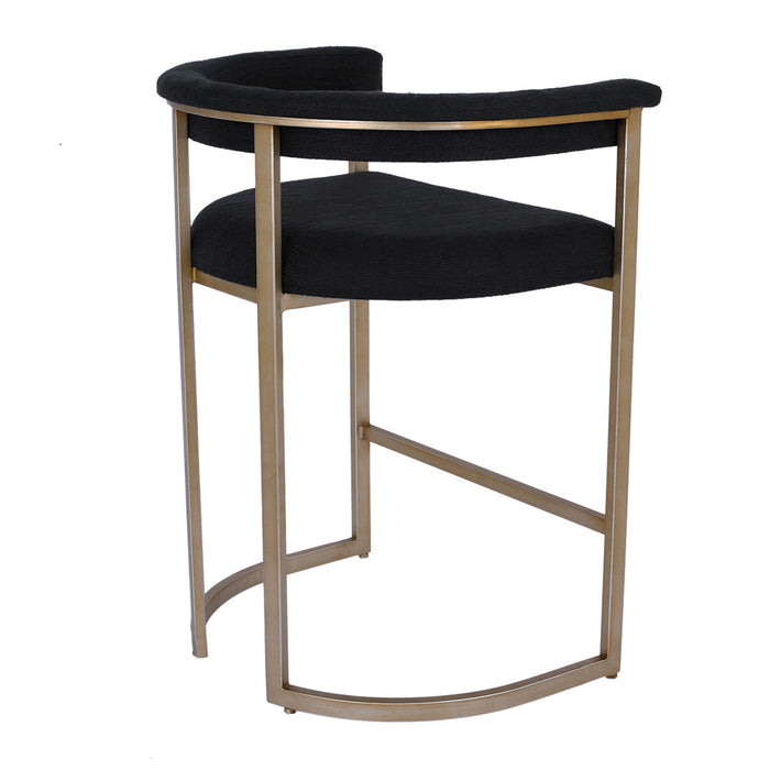 A modern [Brand] chair with black seat, gold frame.