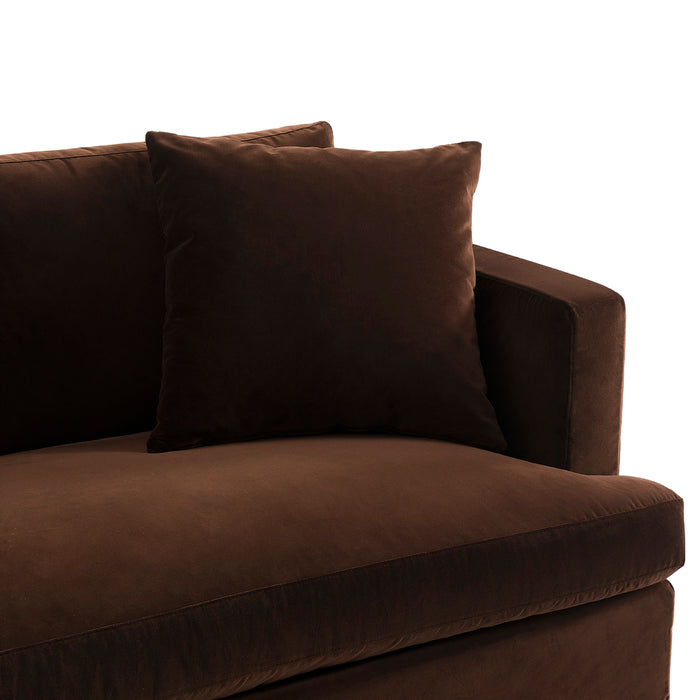 Brown sofa with pillow from [Brand], featuring plush upholstery.