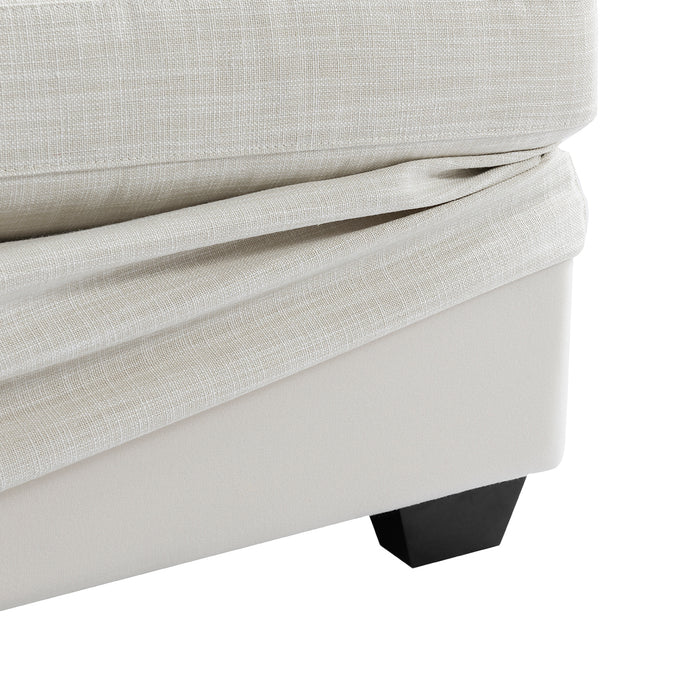 [Brand] beige upholstered furniture with black wooden leg detail.