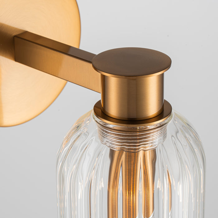 [Brand] brass wall fixture with textured glass dome design.