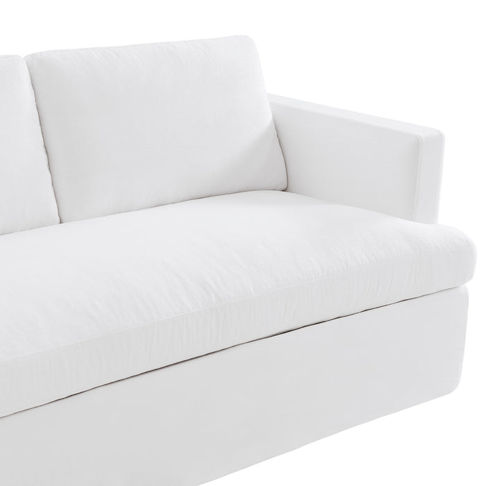 White sofa with plush cushions from [Brand], angled armrest.