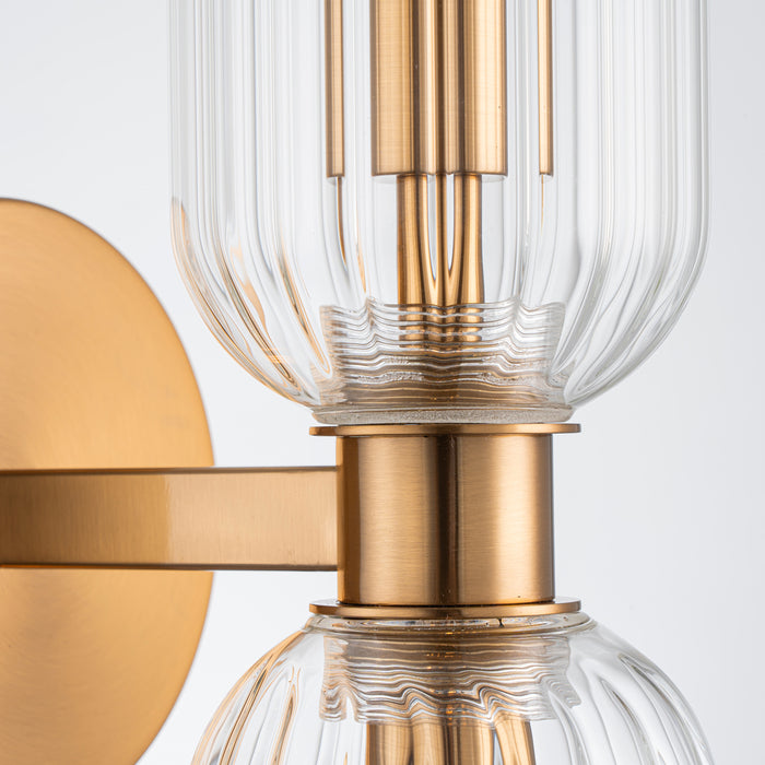 [Brand] brass and glass sconce with ribbed detailing, elegant design.