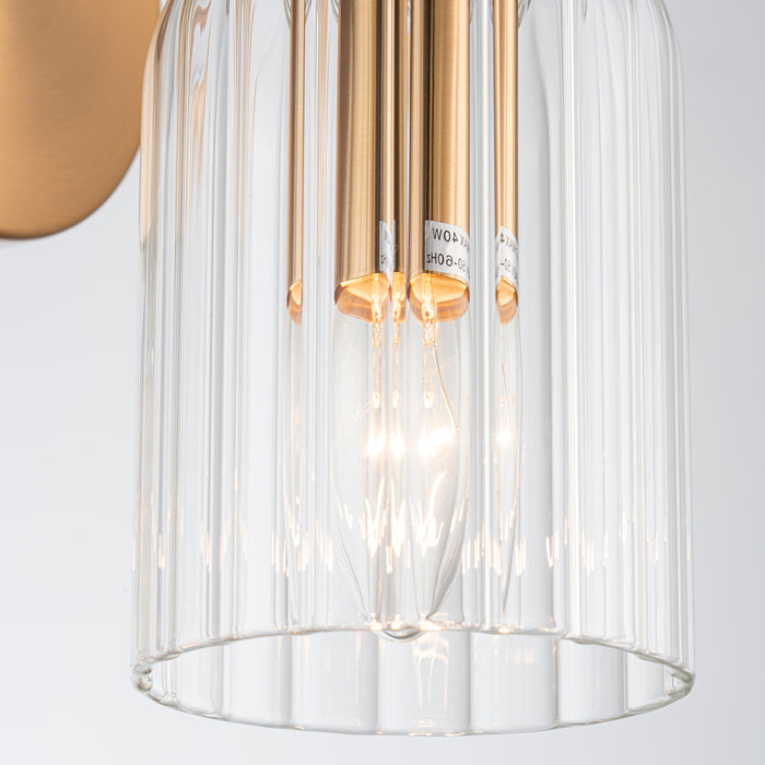 [Brand] clear glass chandelier with glowing light bulbs.
