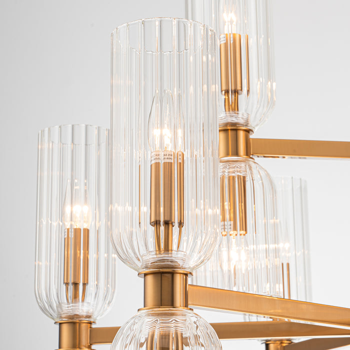 Modern [Brand] chandelier with glass shades and gold finish.