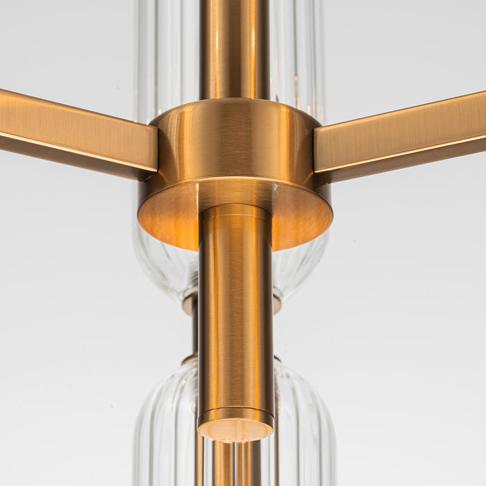 [Brand] chandelier with gold finish and clear glass accents.