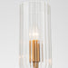 Glass lamp with gold accents, illuminated by [Brand] bulb.